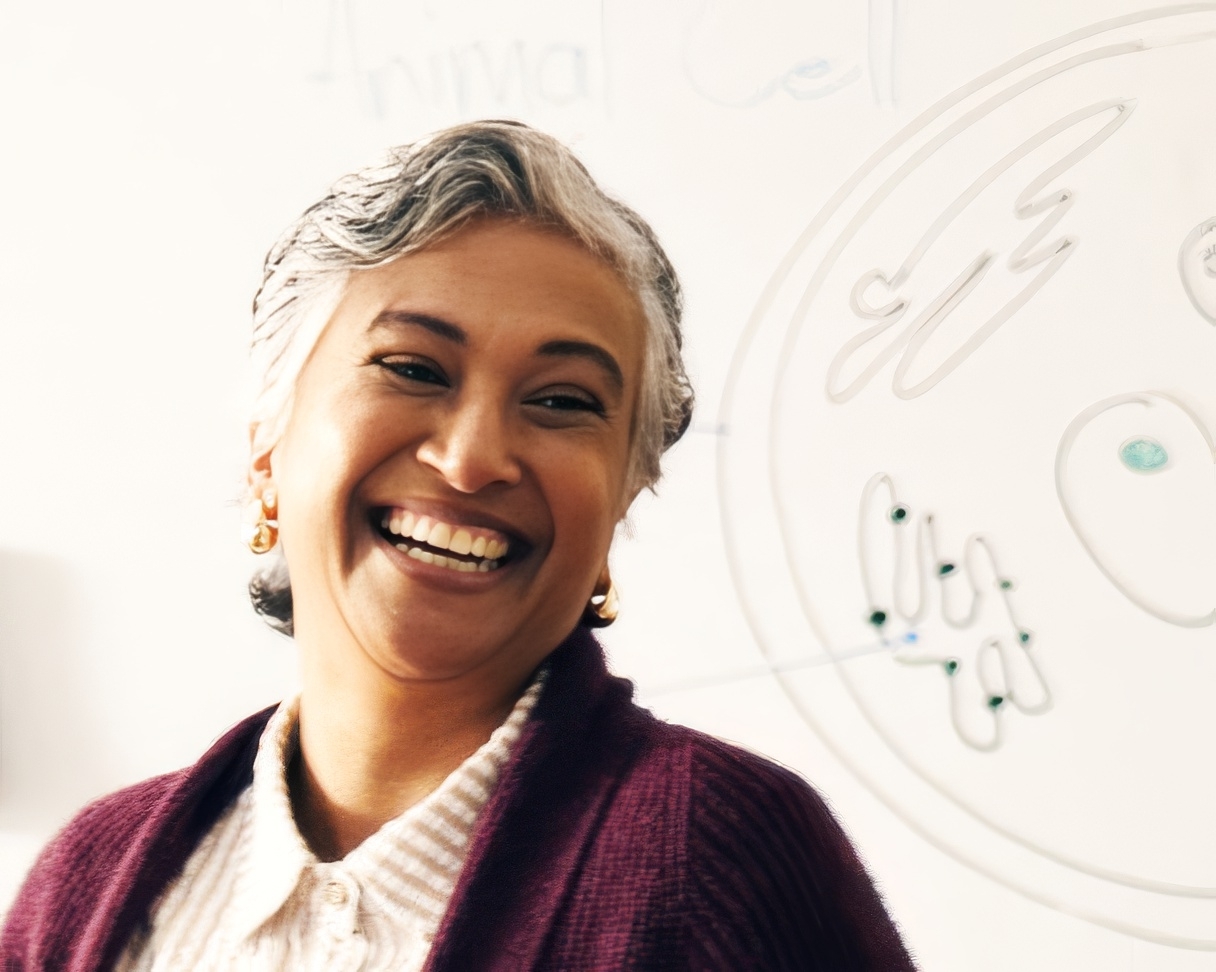 instructor smiling in biology classroom