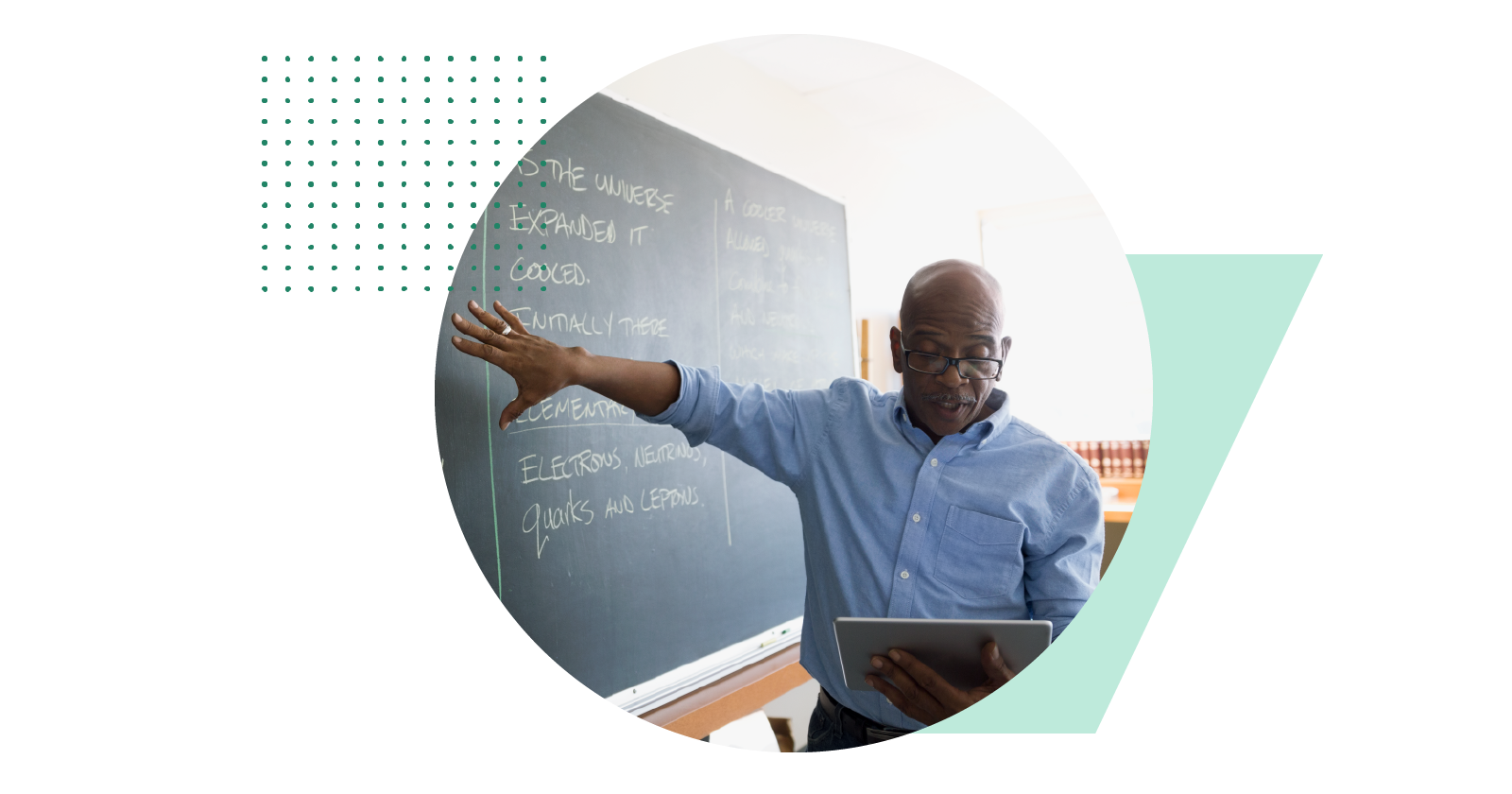 A photograph shows a teacher explaining a topic on a blackboard by referring to his tablet held in one hand.