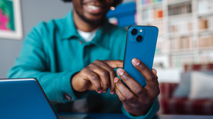 A young man looking at this phone.