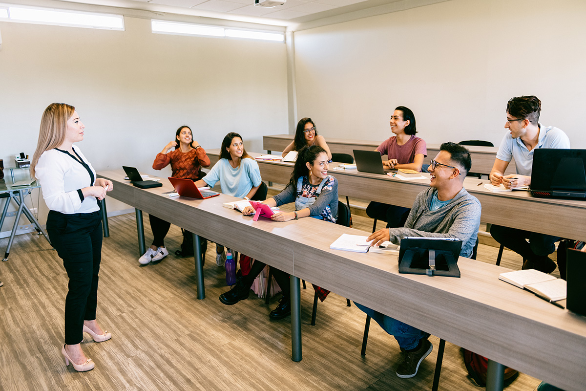 An instructor in front of a classroom of engaged students
