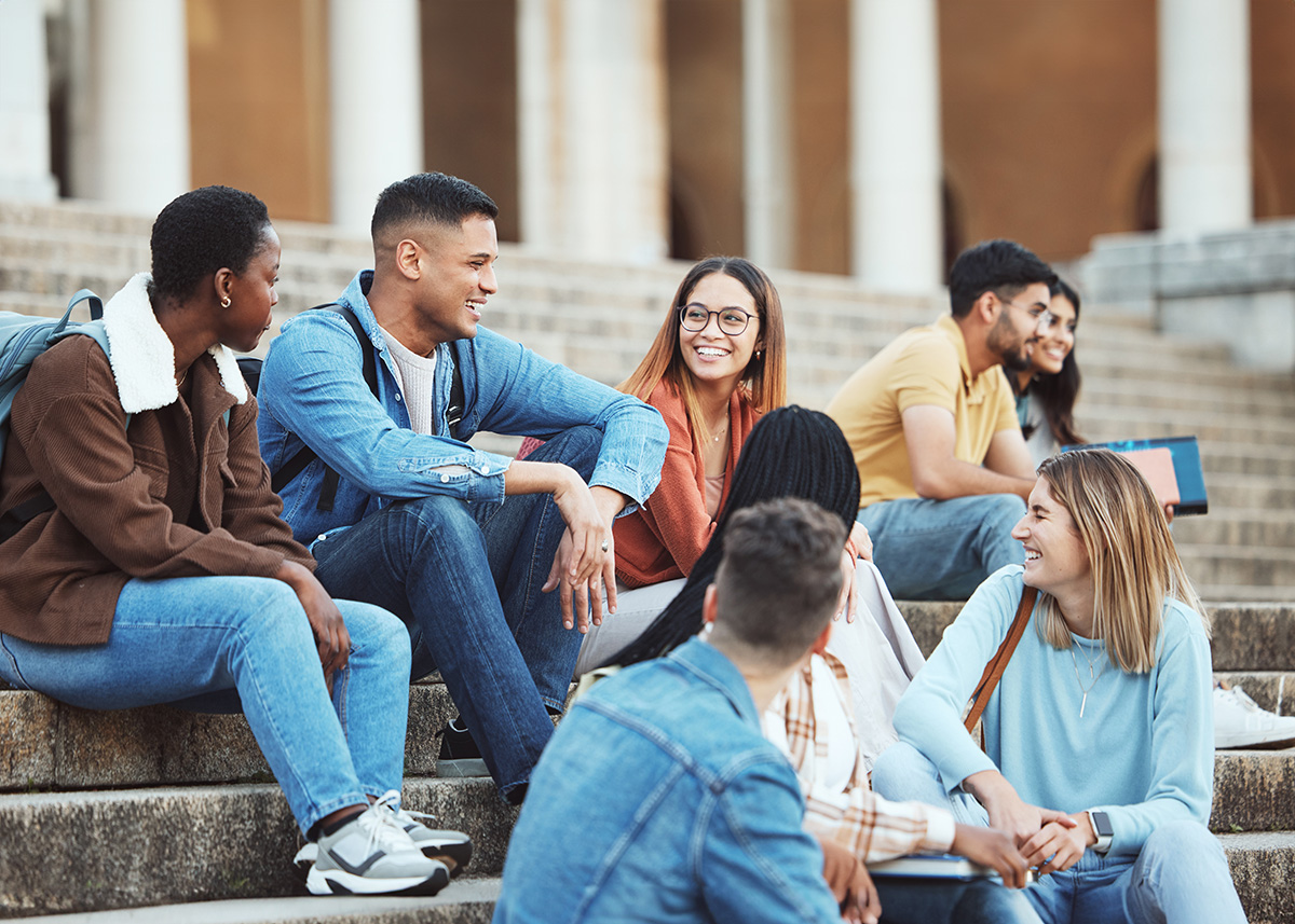 people working on computers in a library
