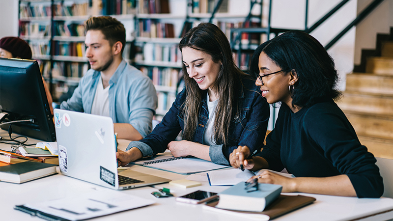 A group of students studying in a library